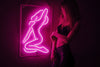 Sexy girl woman pink neon sign for bar, night club, party, erotic striptease